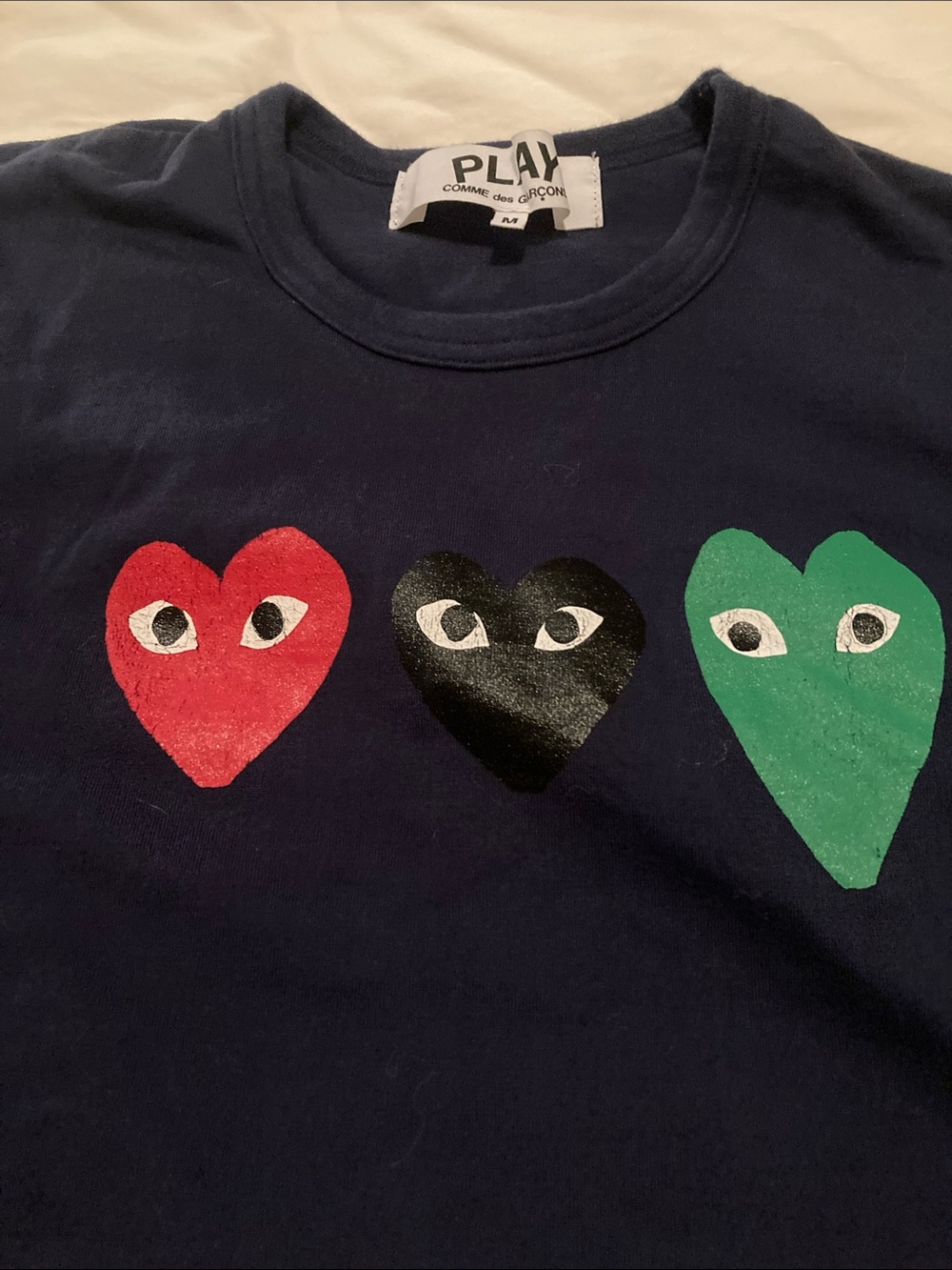 Comme des Garçons PLAY Navy Tee with Red, Black & Green Heart Logos